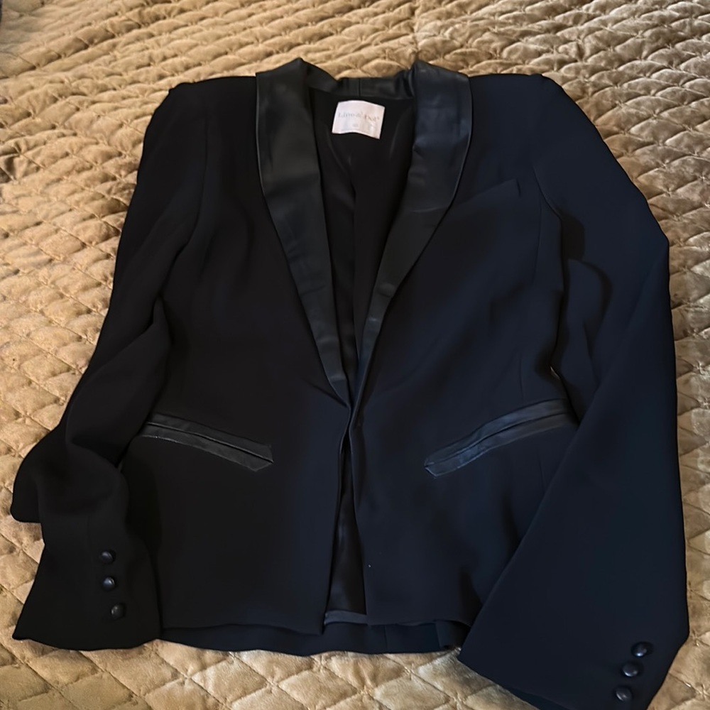 Line & Dot black jacket with lamb leather collar.